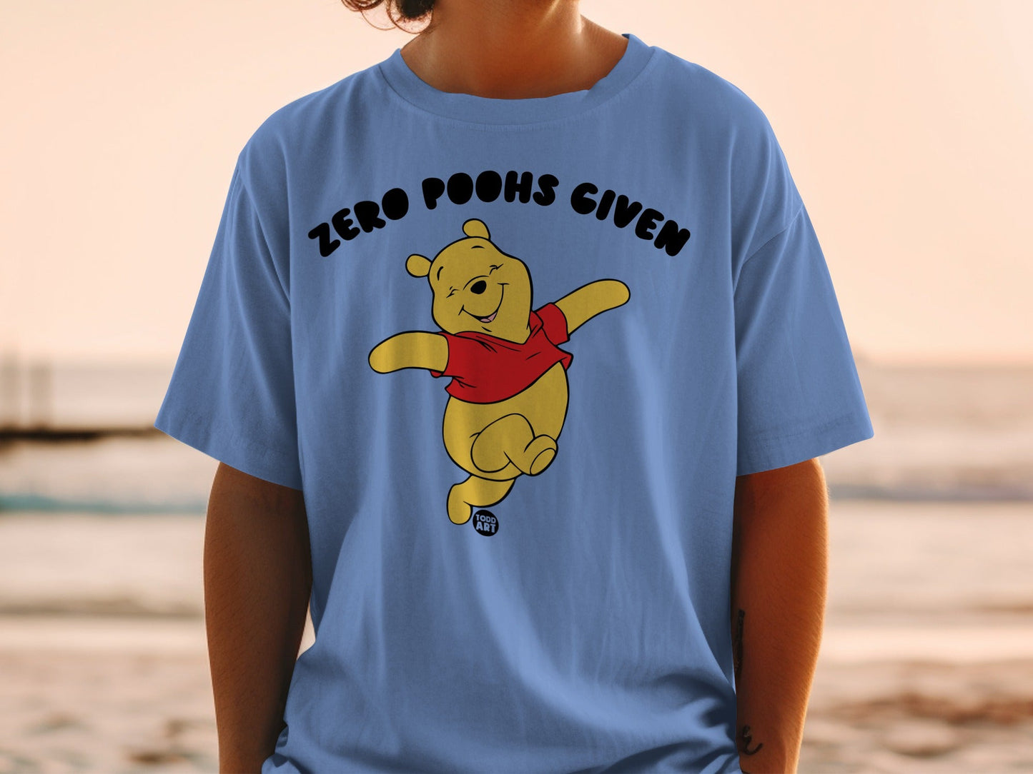 Winnie the Pooh with "Zero Poohs Given" text on a blue t-shirt.