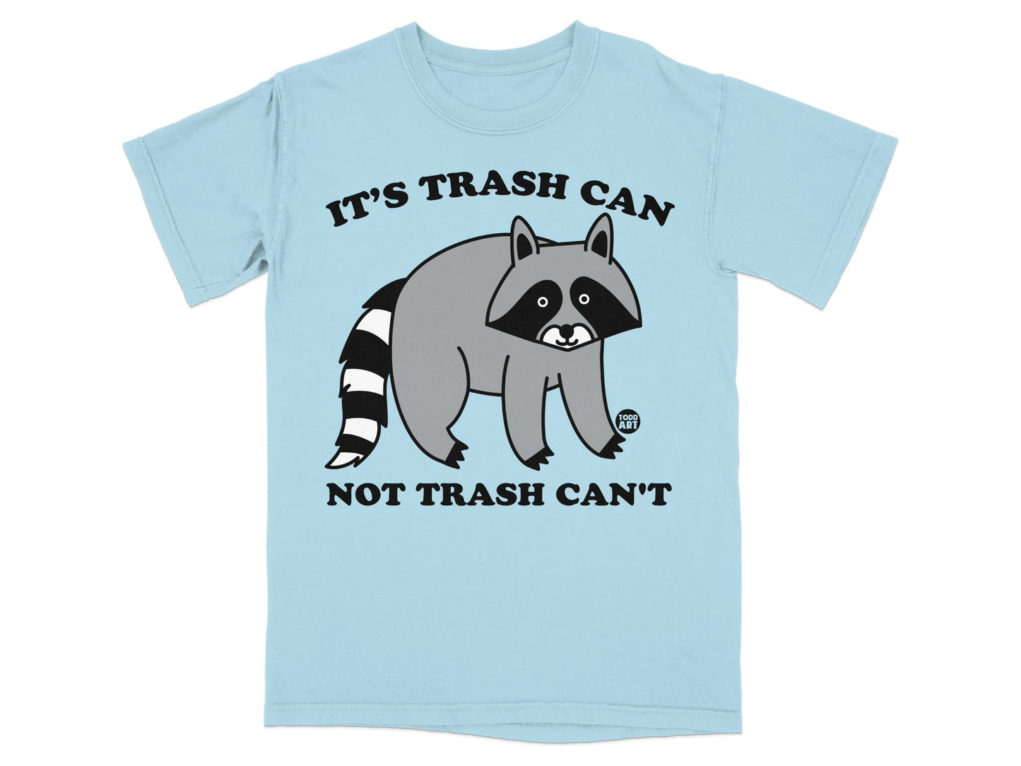 Light blue t-shirt with a raccoon illustration and the text "IT'S TRASH CAN NOT TRASH CAN'T".