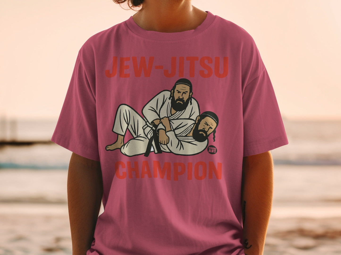 T-shirt with "Jew-Jitsu Champion" text and graphic of two bearded men in gi.