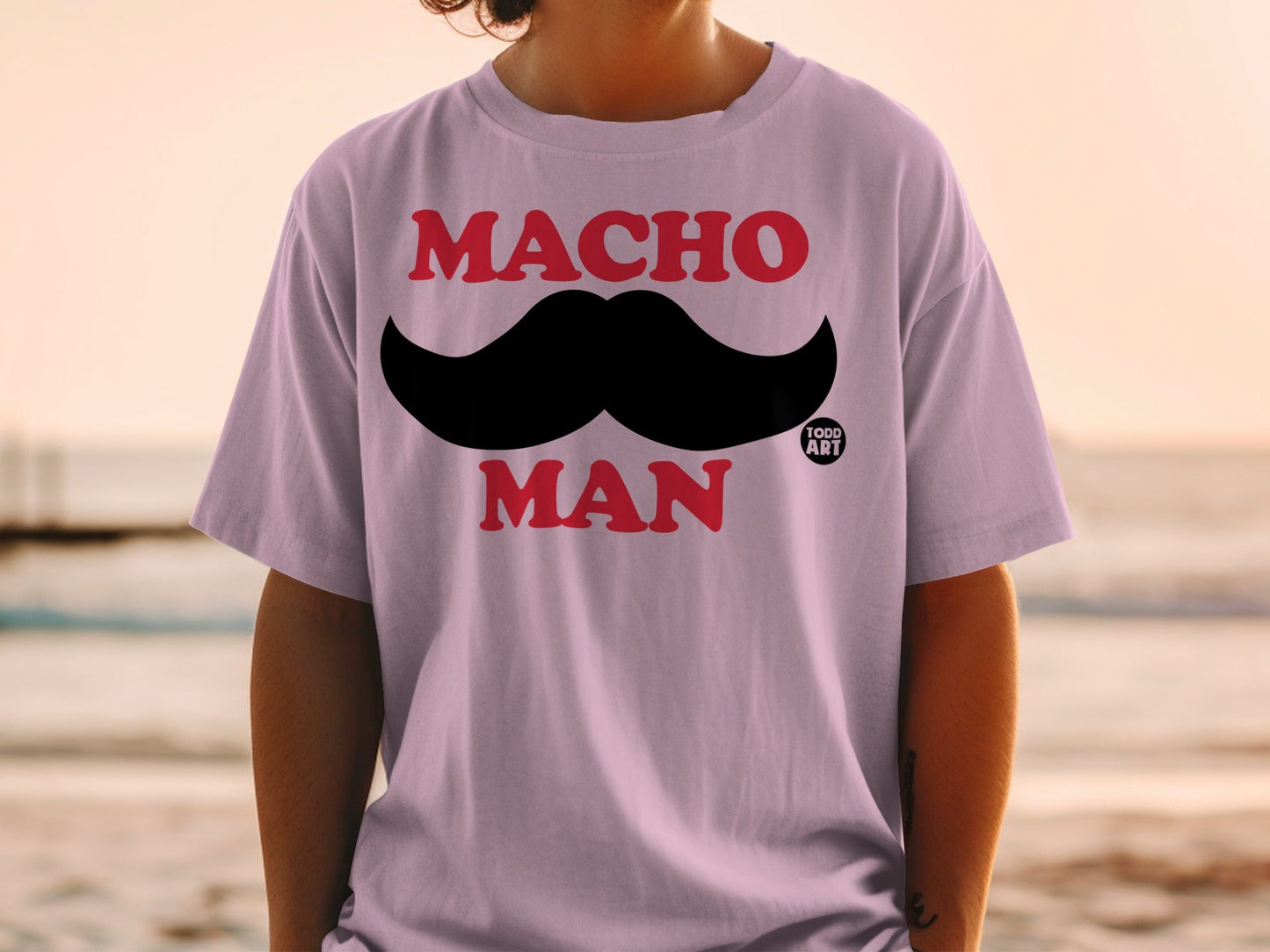Purple t-shirt with black mustache and "MACHO MAN" text.