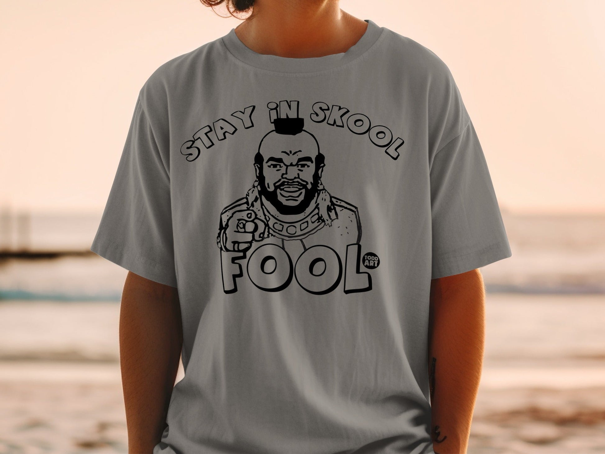 T-shirt with Mr. T graphic saying "STAY IN SKOOL FOOL".