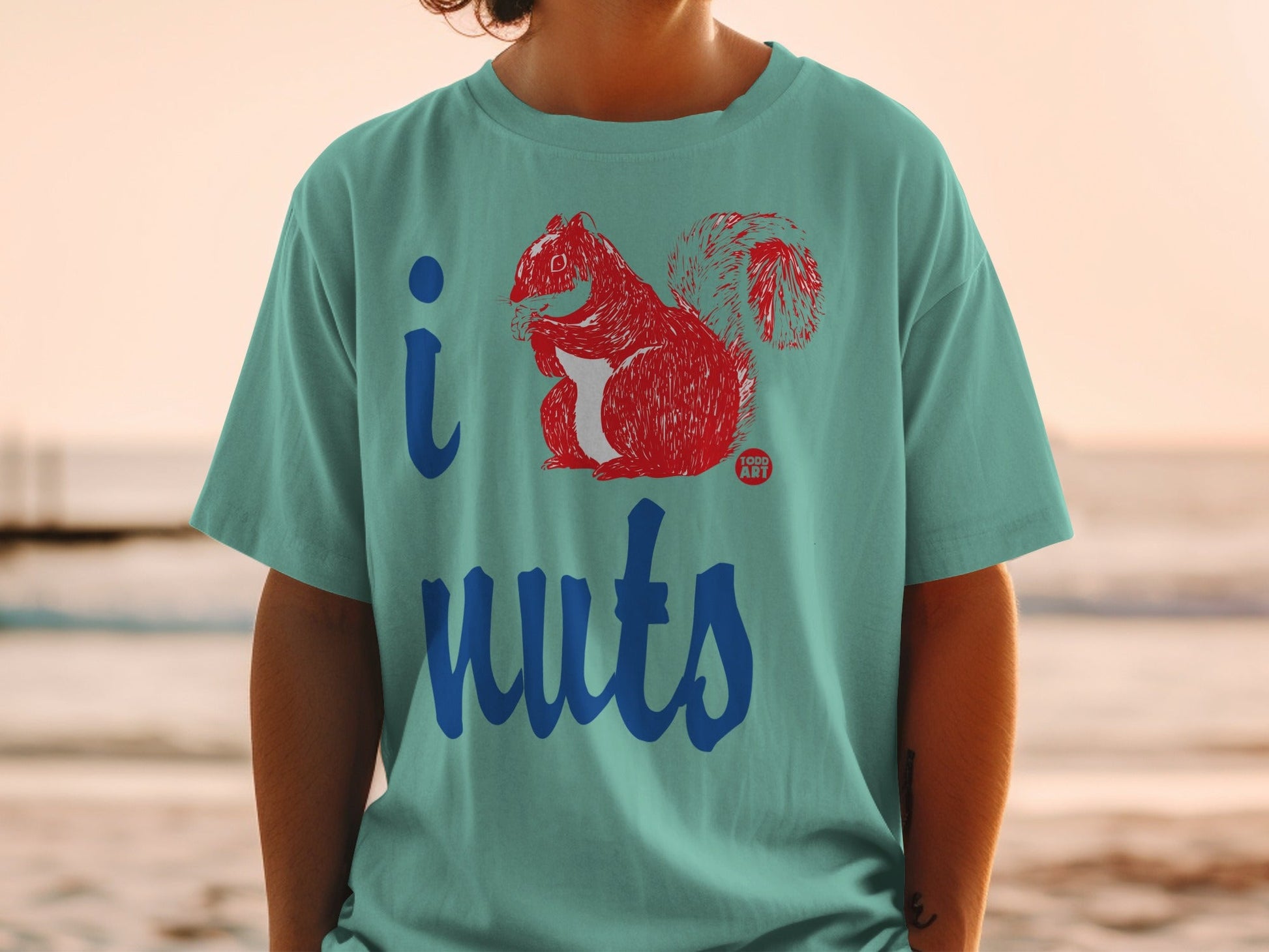 Teal t-shirt with "I Nuts" text and a red squirrel illustration.