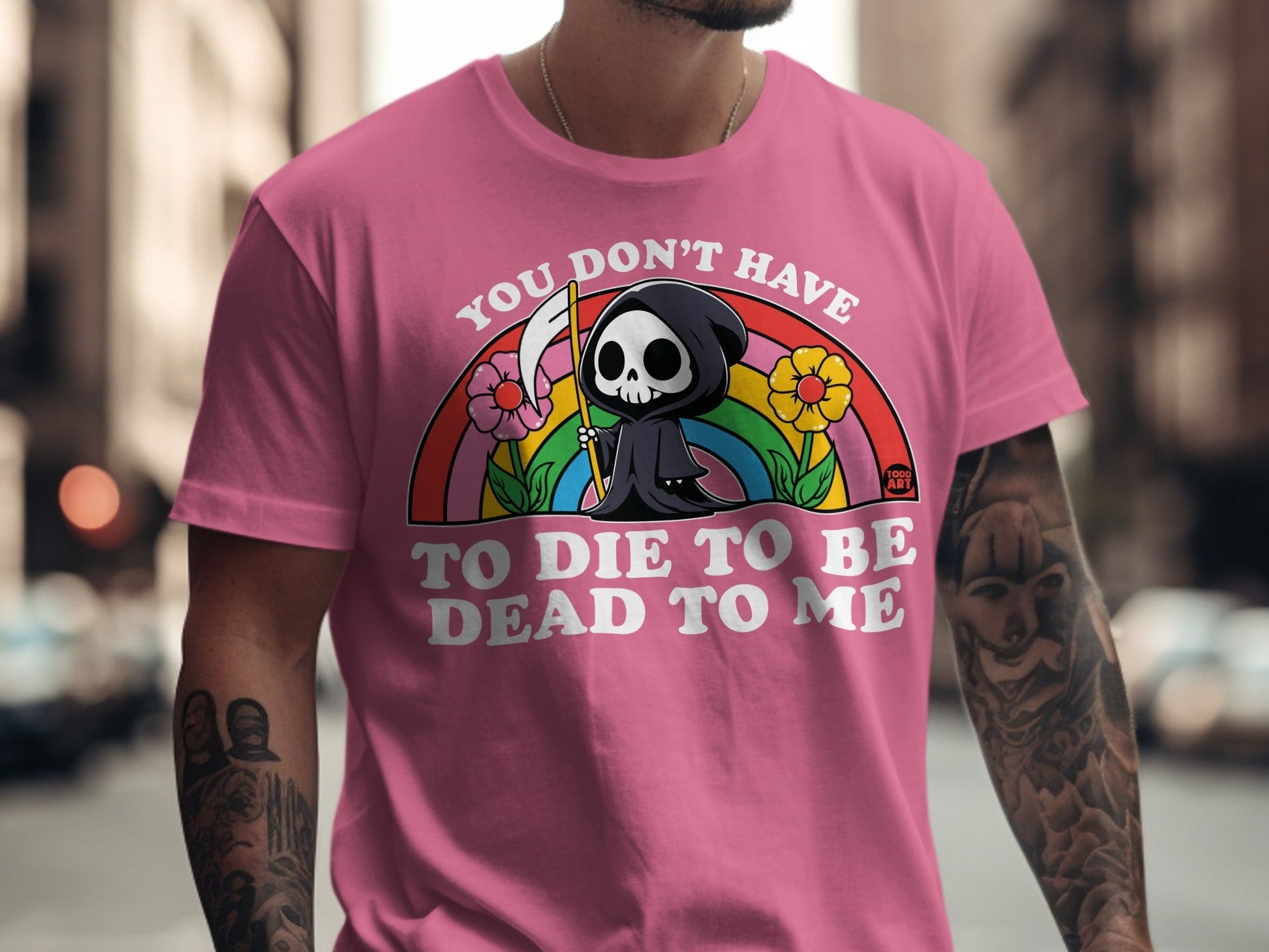 Pink t-shirt with grim reaper and rainbow graphic saying "You don't have to die to be dead to me."