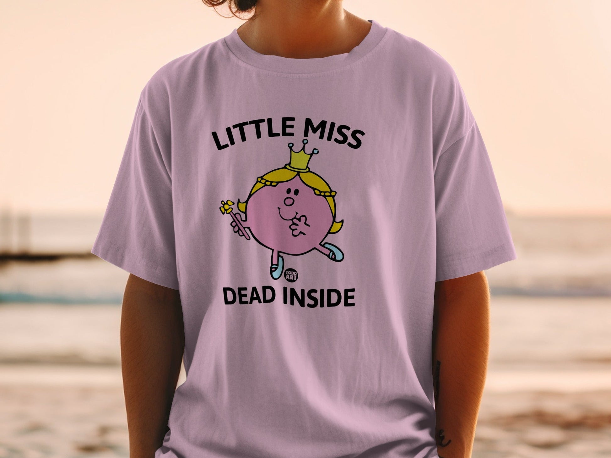 Pink t-shirt with "Little Miss DEAD INSIDE" text and cartoon character.