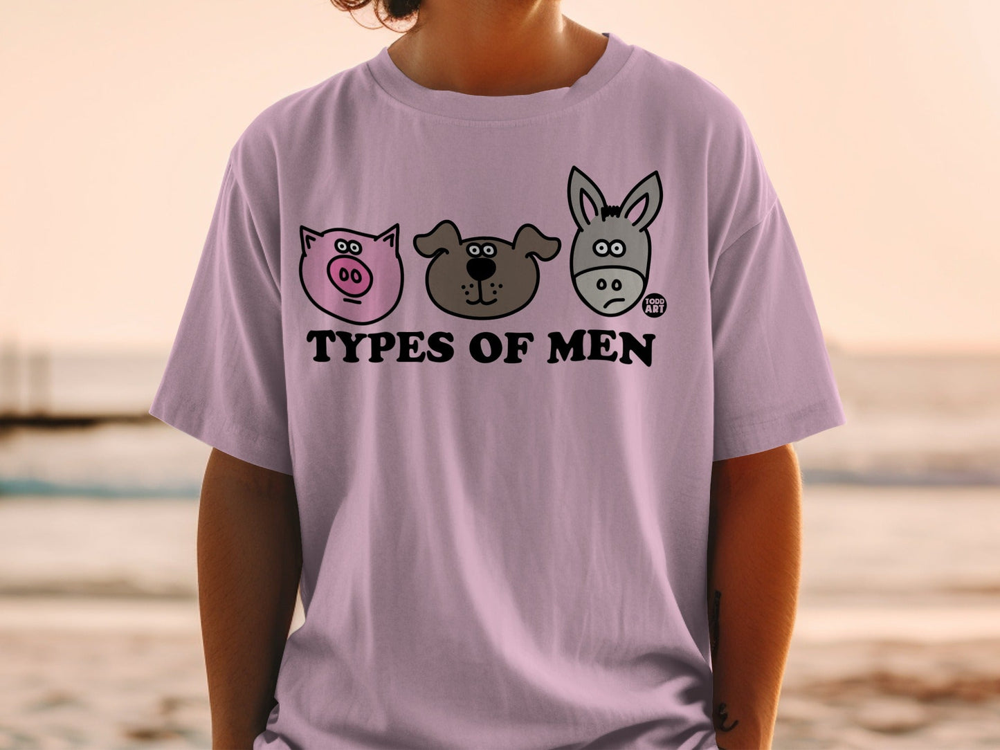 Purple t-shirt with three cartoon animal faces: pig, dog, and donkey.