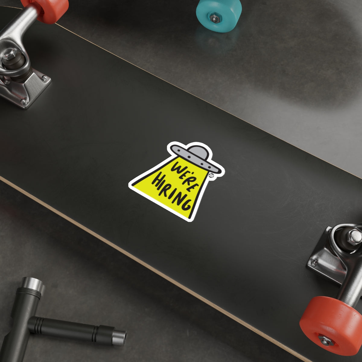 UFO We're Hiring Sticker on Skateboard Deck