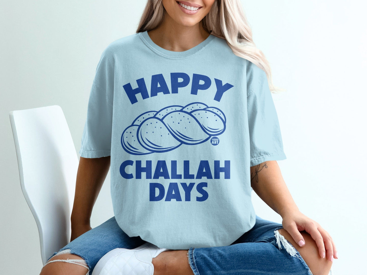 Light blue t-shirt with "Happy Challah Days" text and challah bread graphic.