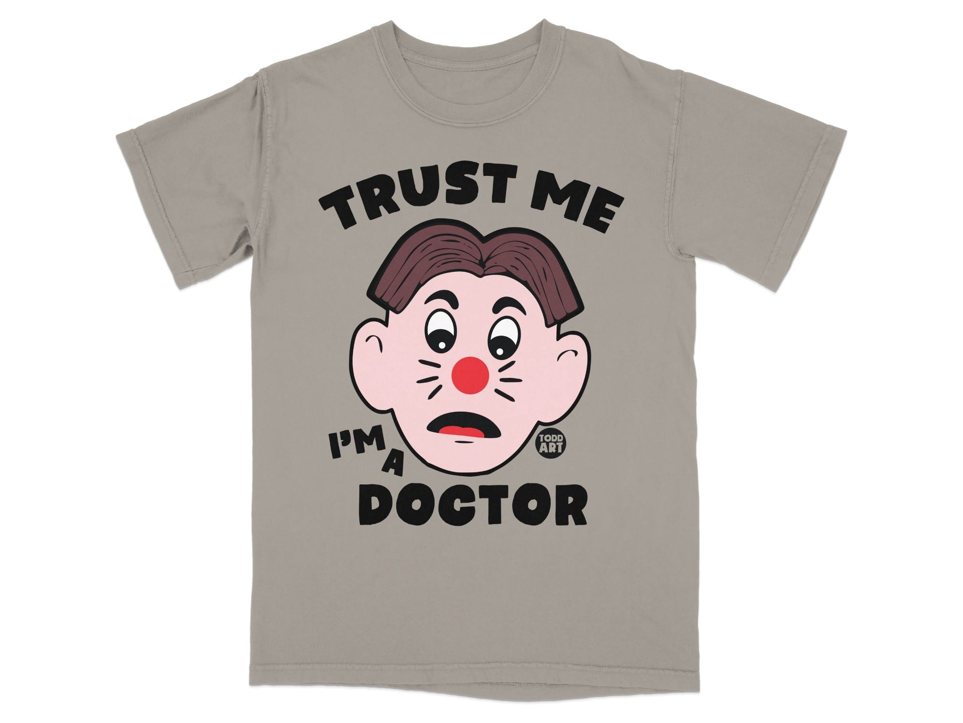 Gray t-shirt with cartoon face and text "TRUST ME I'M A DOCTOR".