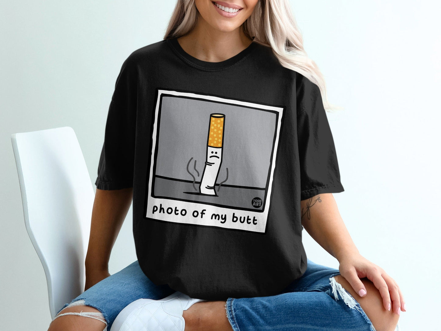 Black t-shirt with a cartoon cigarette graphic and "photo of my butt" text.