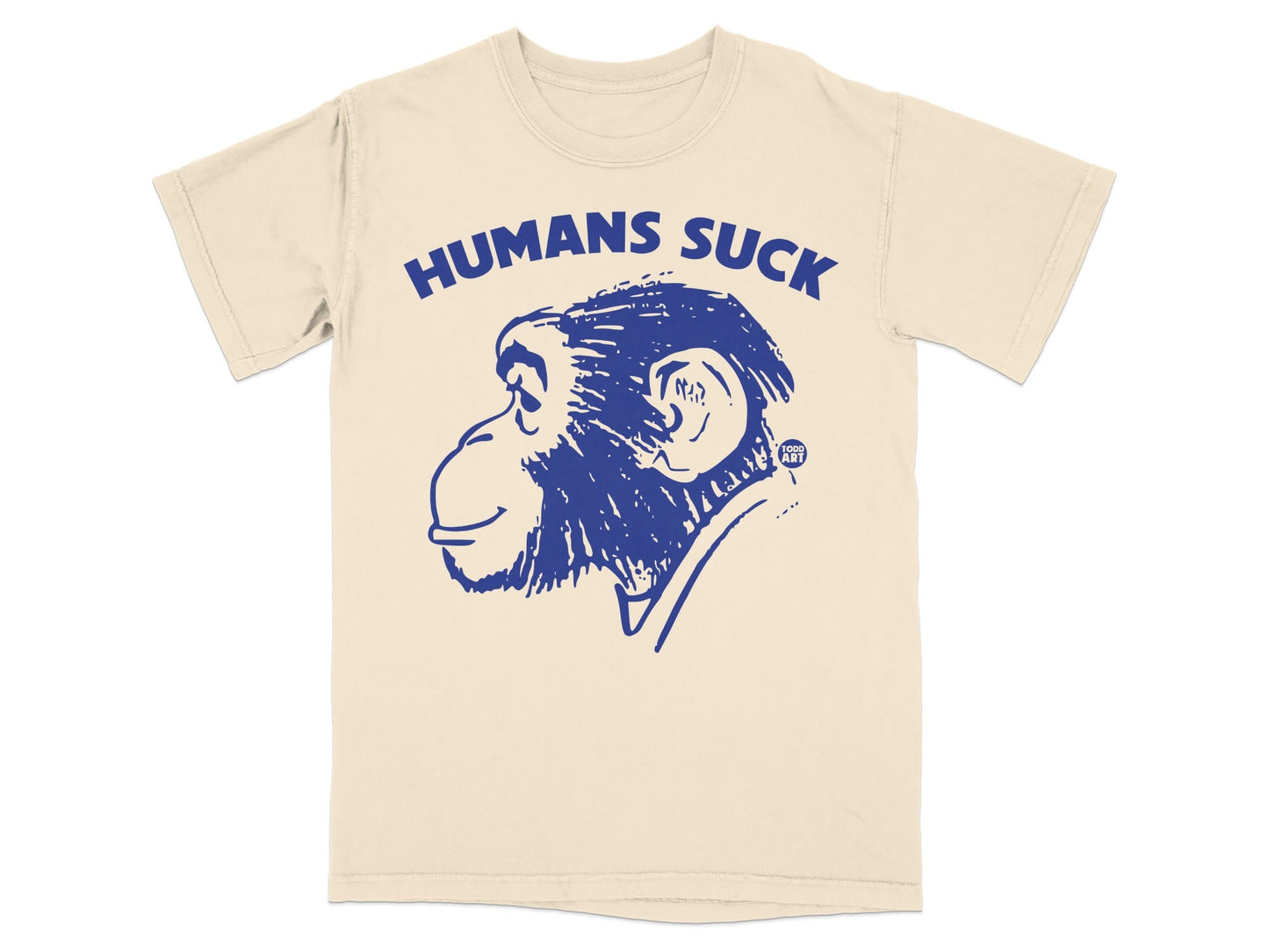 Cream t-shirt with blue graphic of a chimpanzee head and text "HUMANS SUCK".