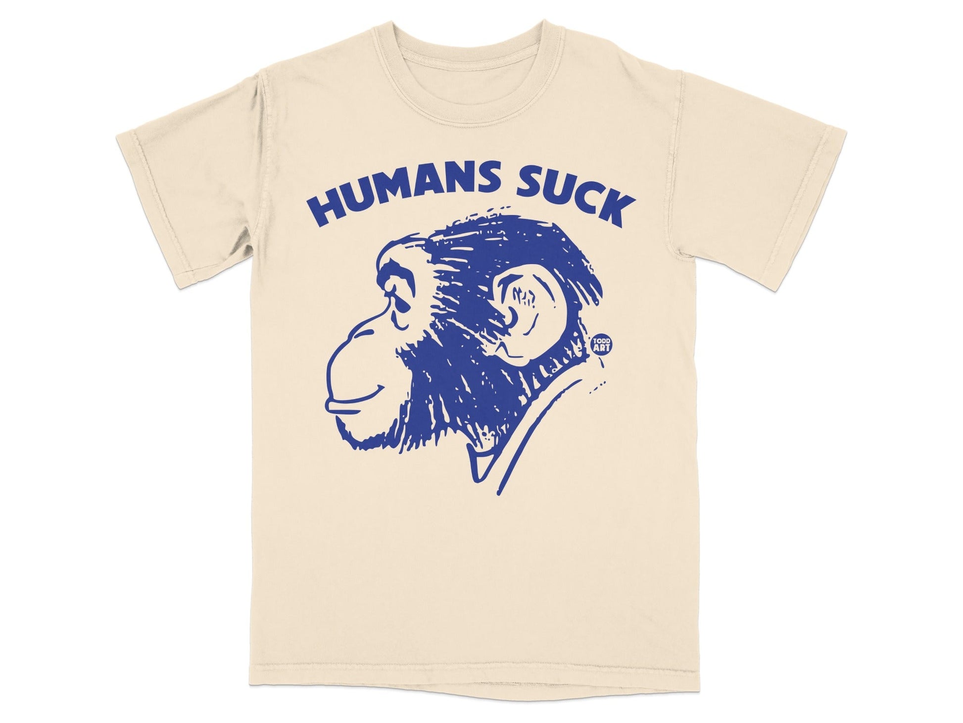 Cream t-shirt with blue graphic of a chimpanzee head and text "HUMANS SUCK".