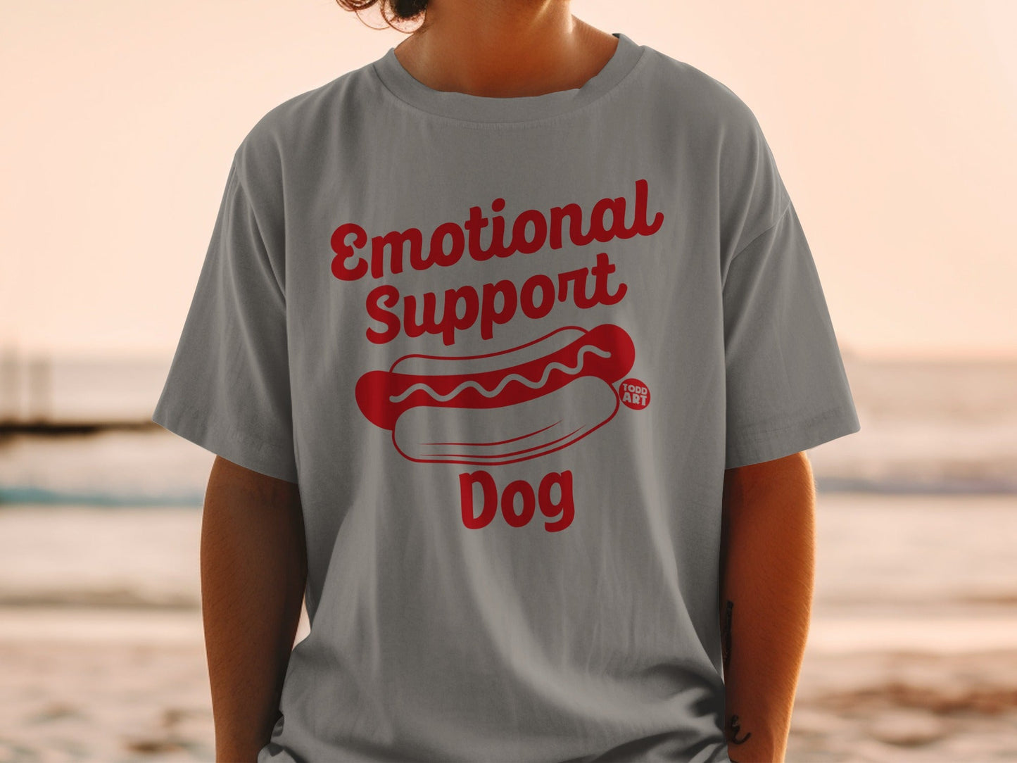 Grey t-shirt with red text "Emotional Support Dog" and a hot dog graphic.
