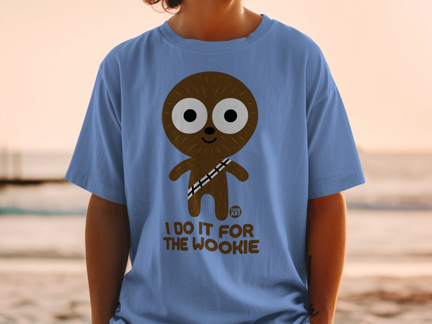 Blue t-shirt with "I DO IT FOR THE WOOKIE" and a cartoon character.