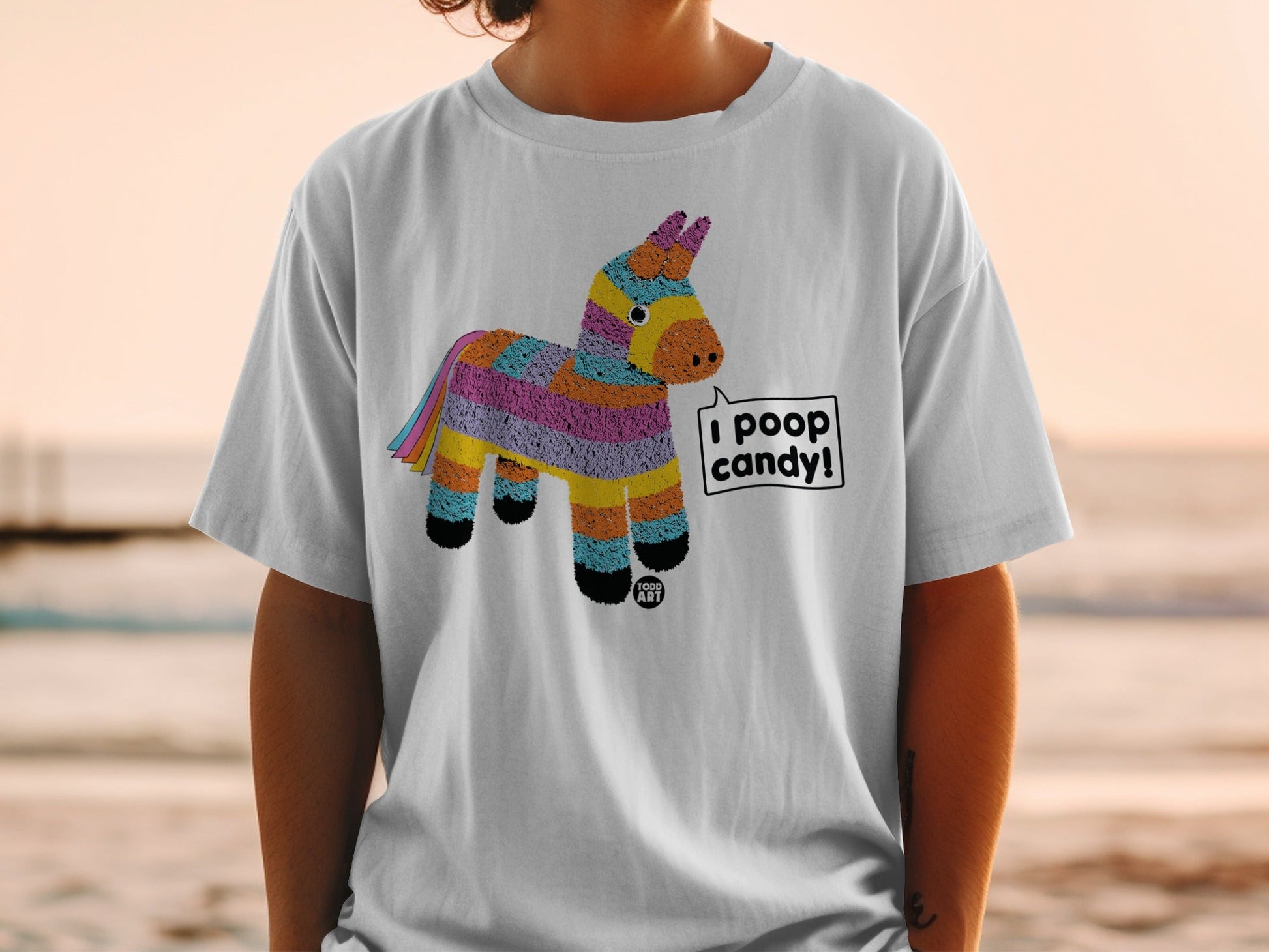T-shirt with cartoon donkey pi√±ata saying "I POOP CANDY!"