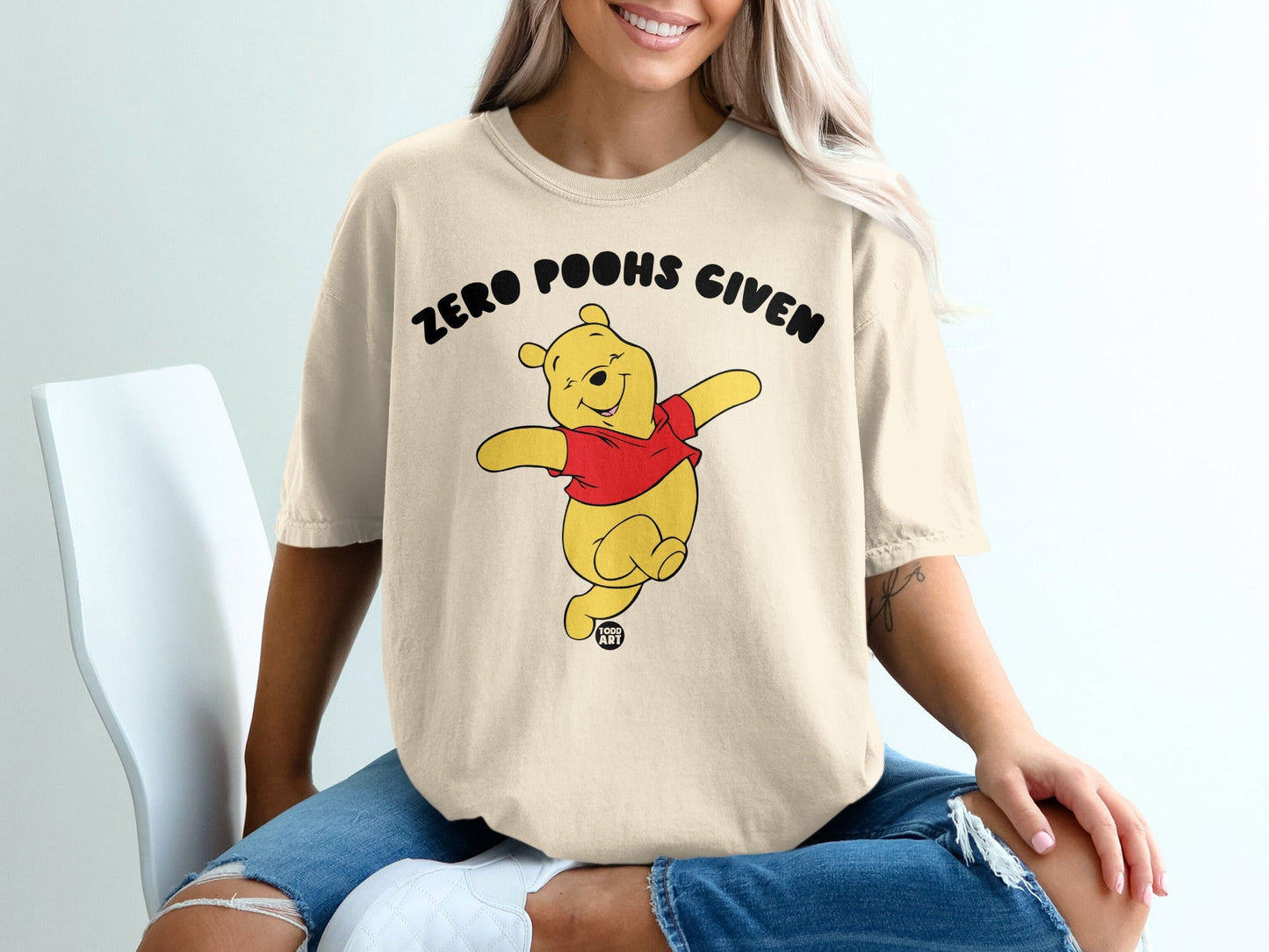 Winnie the Pooh t-shirt with "Zero Poohs Given" text.