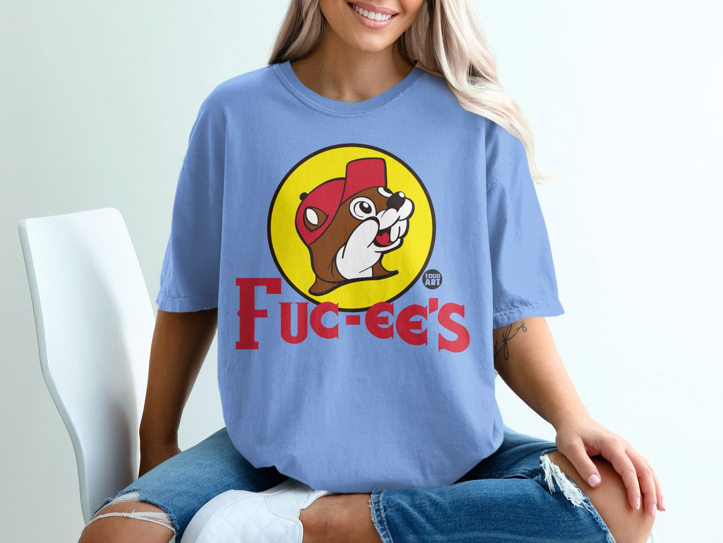 Light blue t-shirt with Buc-ee's beaver logo and text.