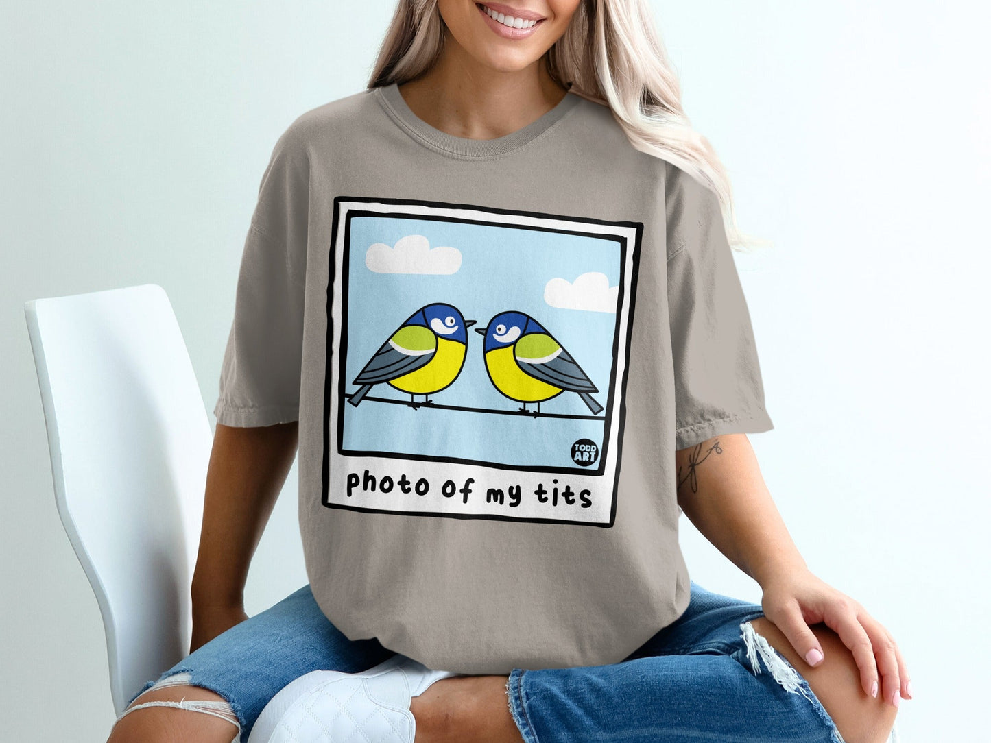Two blue tits perched on a wire, text "photo of my tits" below.