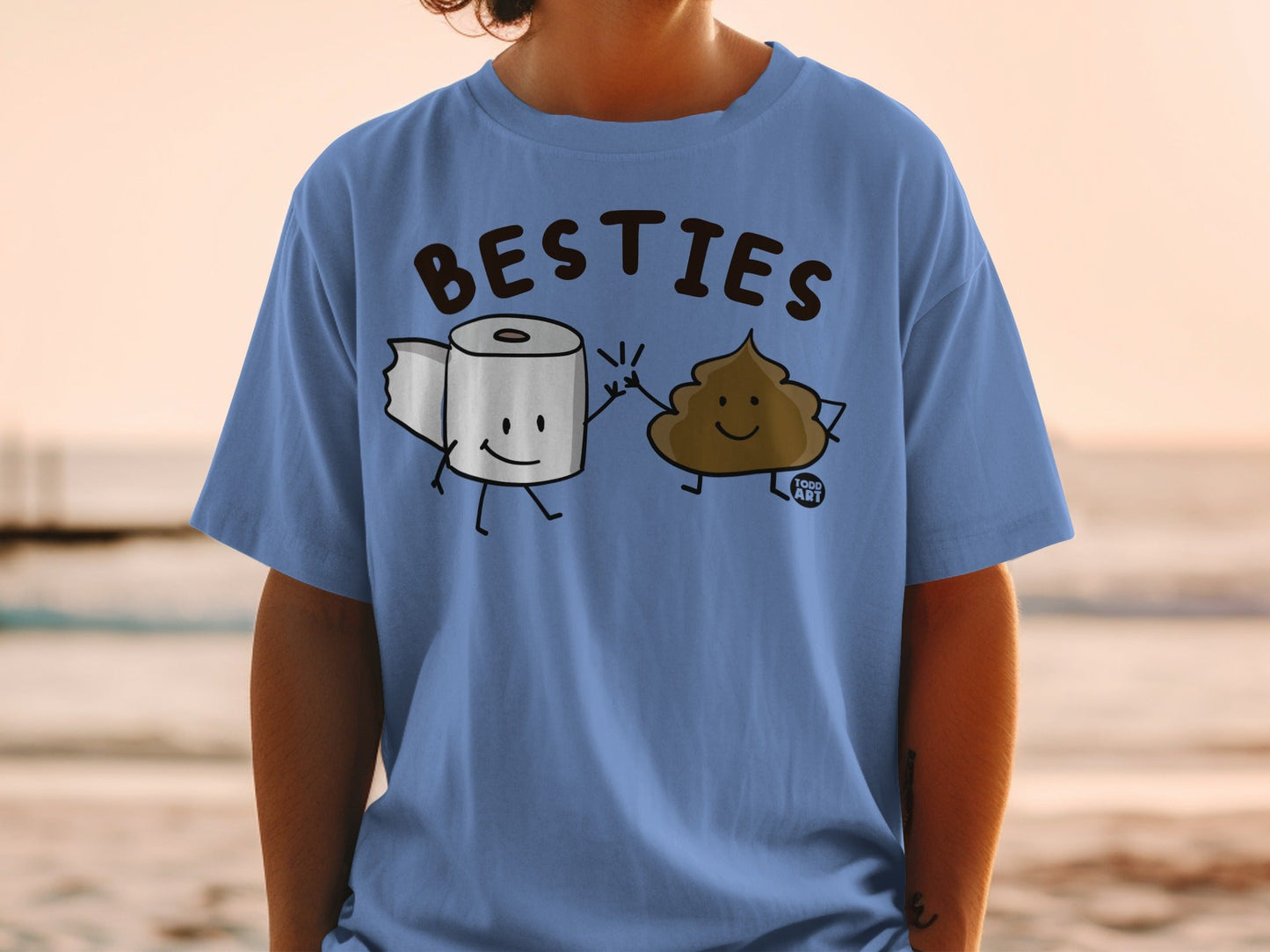 T-shirt with cartoon toilet paper and poop characters giving a high five.