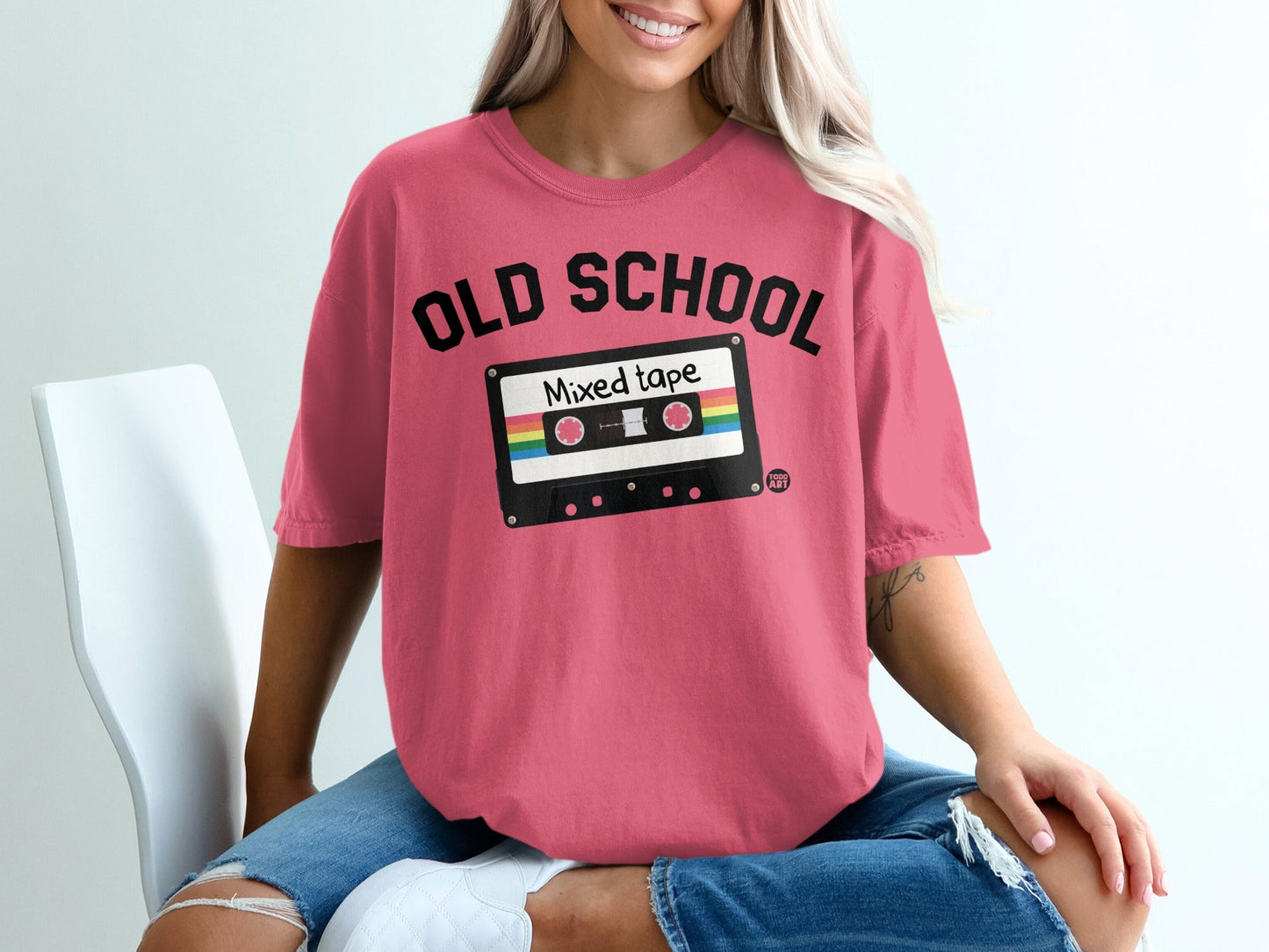 Pink t-shirt with "OLD SCHOOL Mixed tape" graphic of a cassette tape.