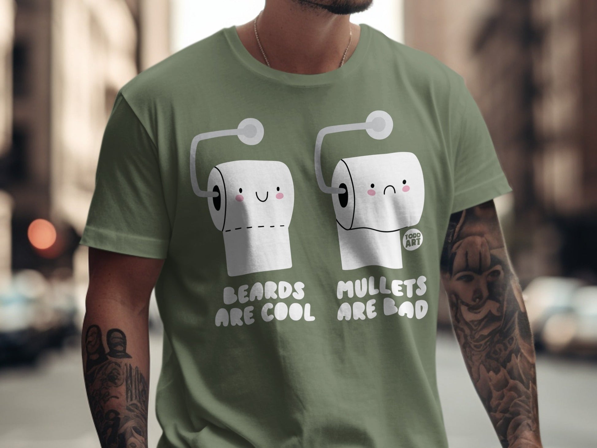 Green t-shirt with cartoon toilet paper rolls, one happy, one sad, text reads "BEARDS ARE COOL MULLETS ARE BAD".
