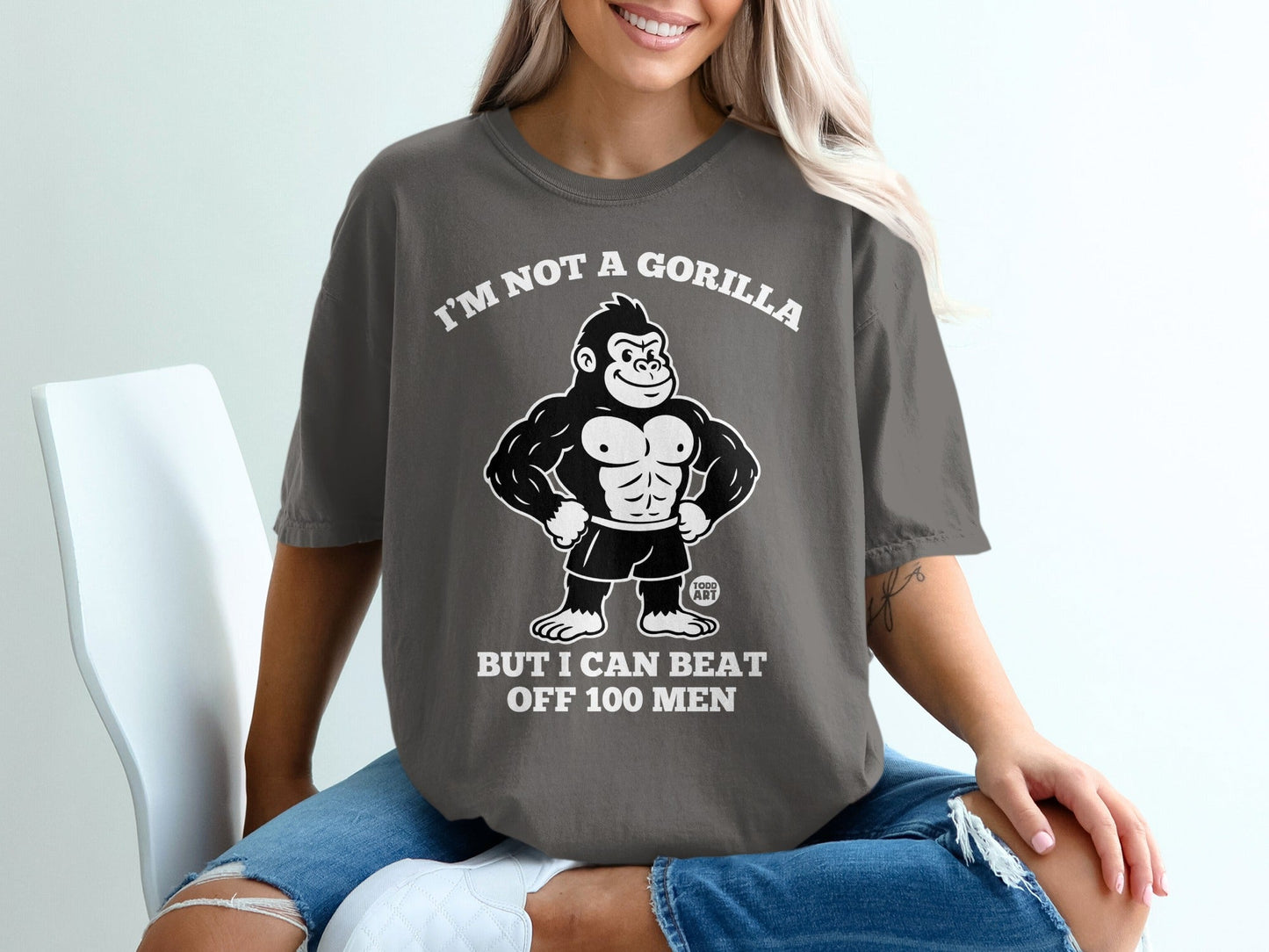 Graphic tee with gorilla illustration and text "I'm not a gorilla but I can beat off 100 men".