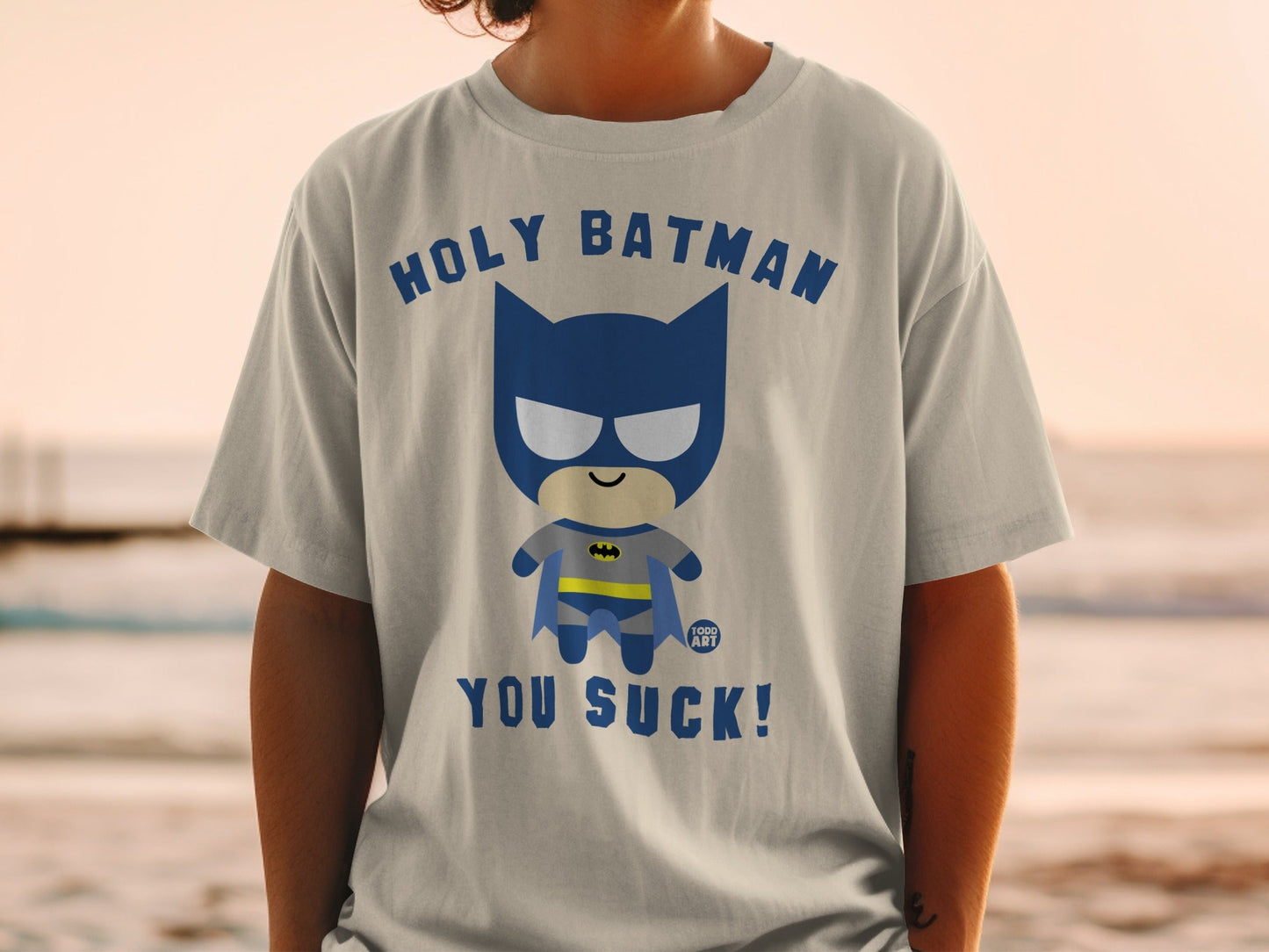 Chibi Batman graphic tee with text "HOLY BATMAN YOU SUCK!".