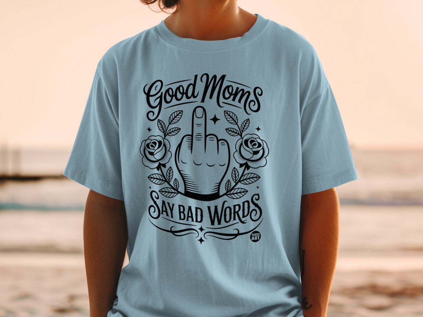Light blue t-shirt with "Good Moms Say Bad Words" and floral artwork.