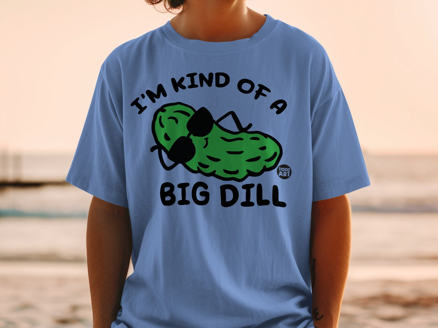 Light blue t-shirt with a cartoon pickle wearing sunglasses and text "I'M KIND OF A BIG DILL".