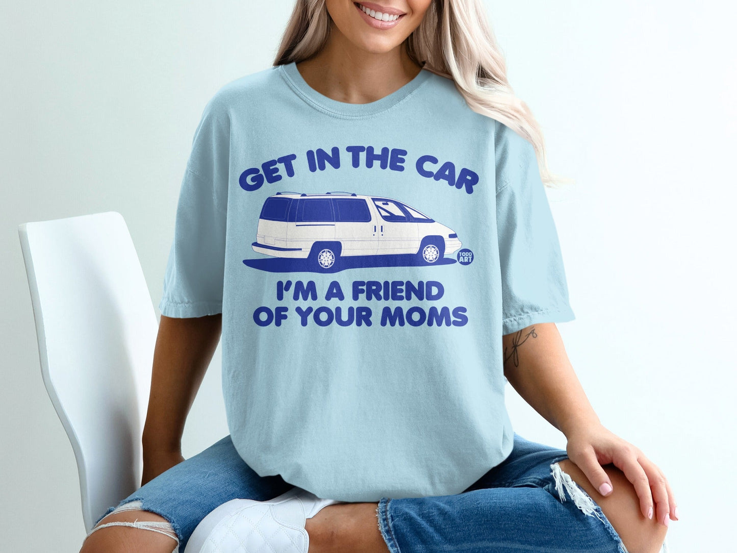 Light blue t-shirt with "GET IN THE CAR I'M A FRIEND OF YOUR MOMS" and a van graphic.