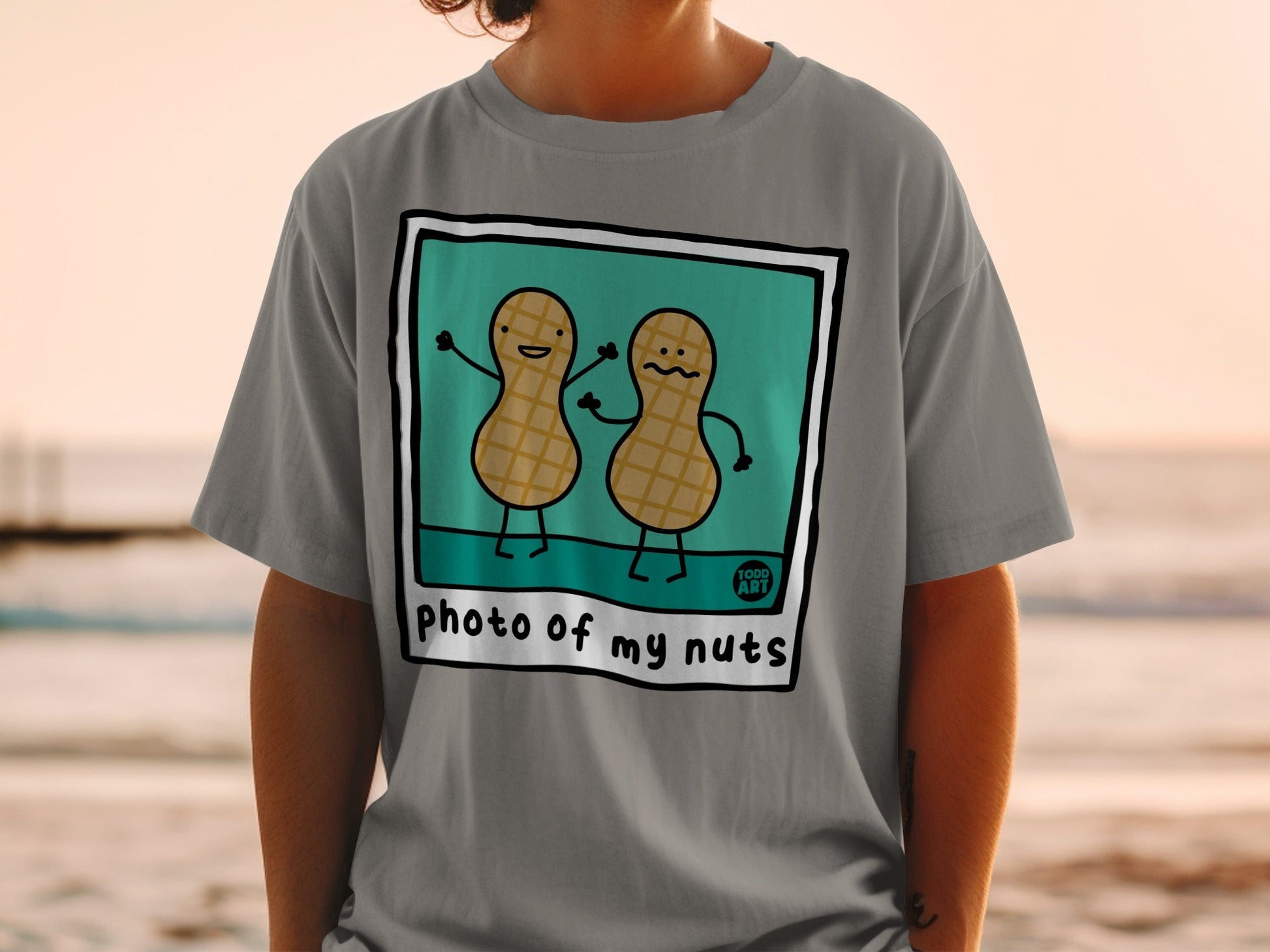 Two cartoon peanuts with arms raised in greeting, "photo of my nuts" text.