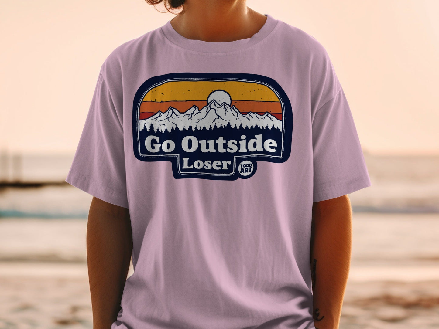 Purple t-shirt with "Go Outside Loser" mountain sunset graphic by Todd Art.