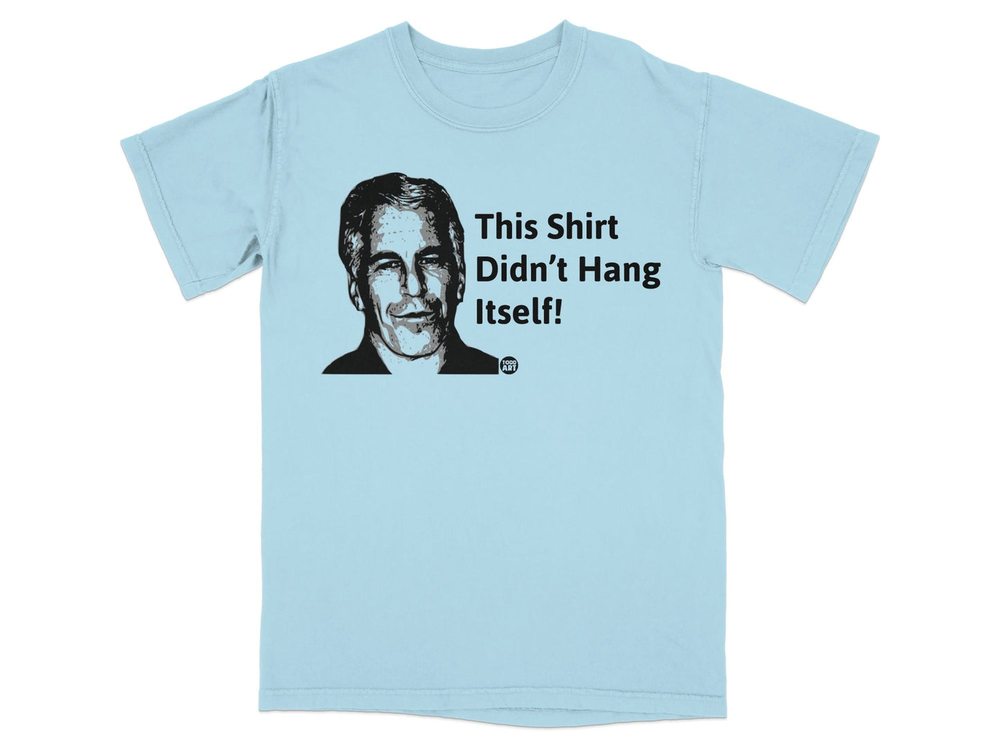 Light blue t-shirt with a portrait and "This Shirt Didn't Hang Itself!" text.