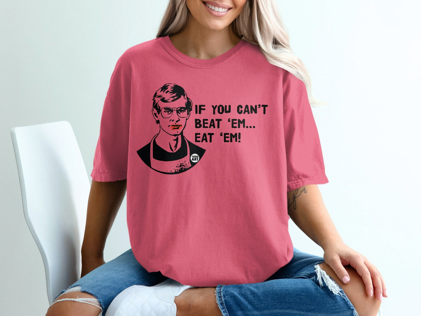Woman wearing a pink t-shirt with text and Ruth Bader Ginsburg graphic.