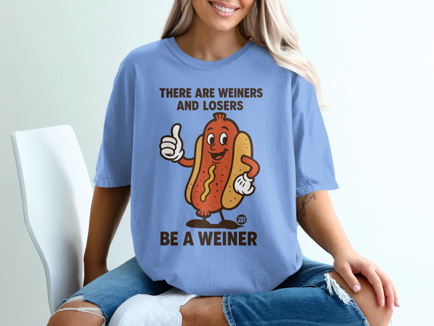T-shirt with cartoon hot dog and text "There are weiners and losers. Be a weiner."