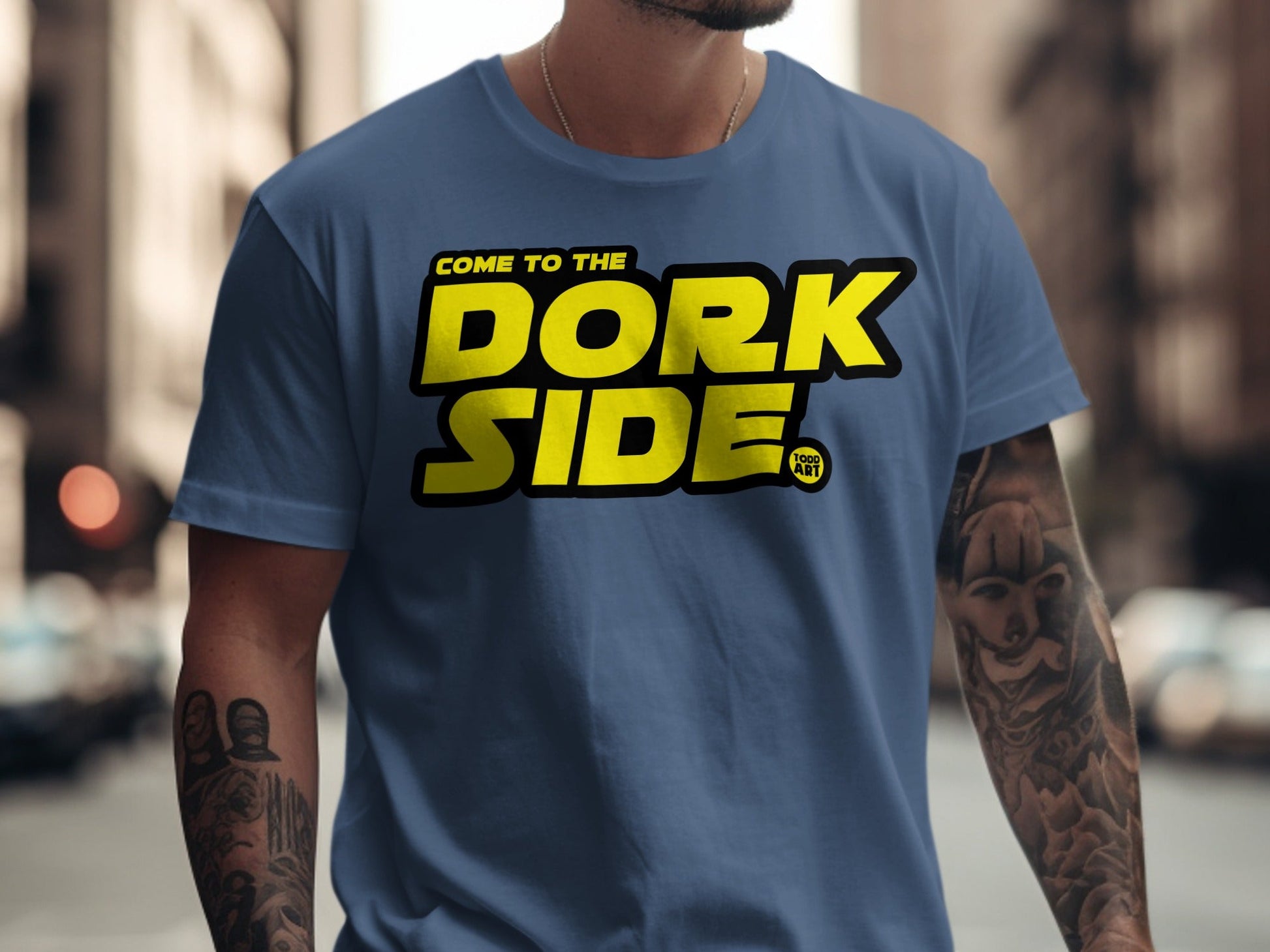 Blue t-shirt with "Come to the Dork Side" text and a small logo.