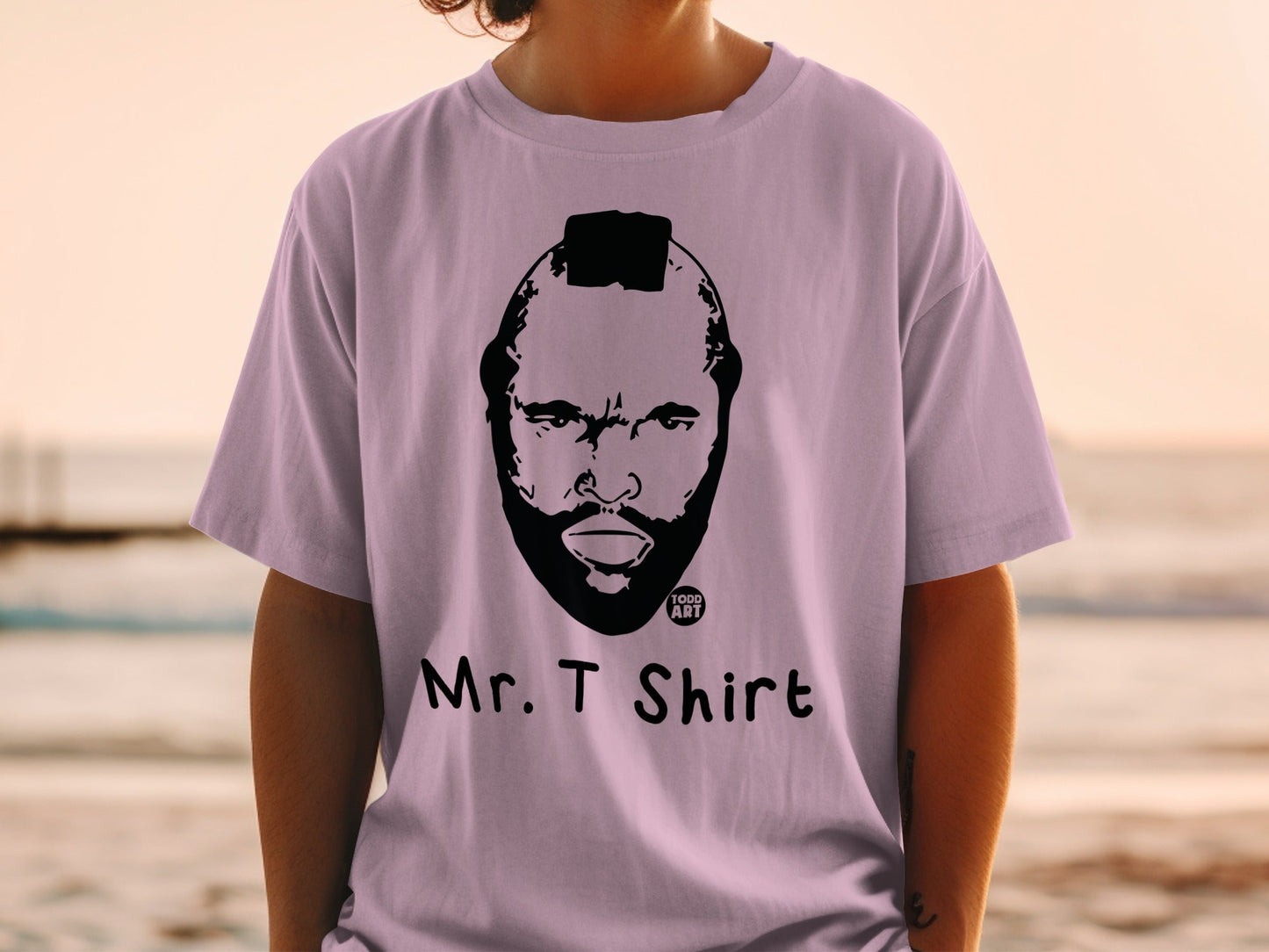 Mr. T shirt with a black graphic of his face and bald head.