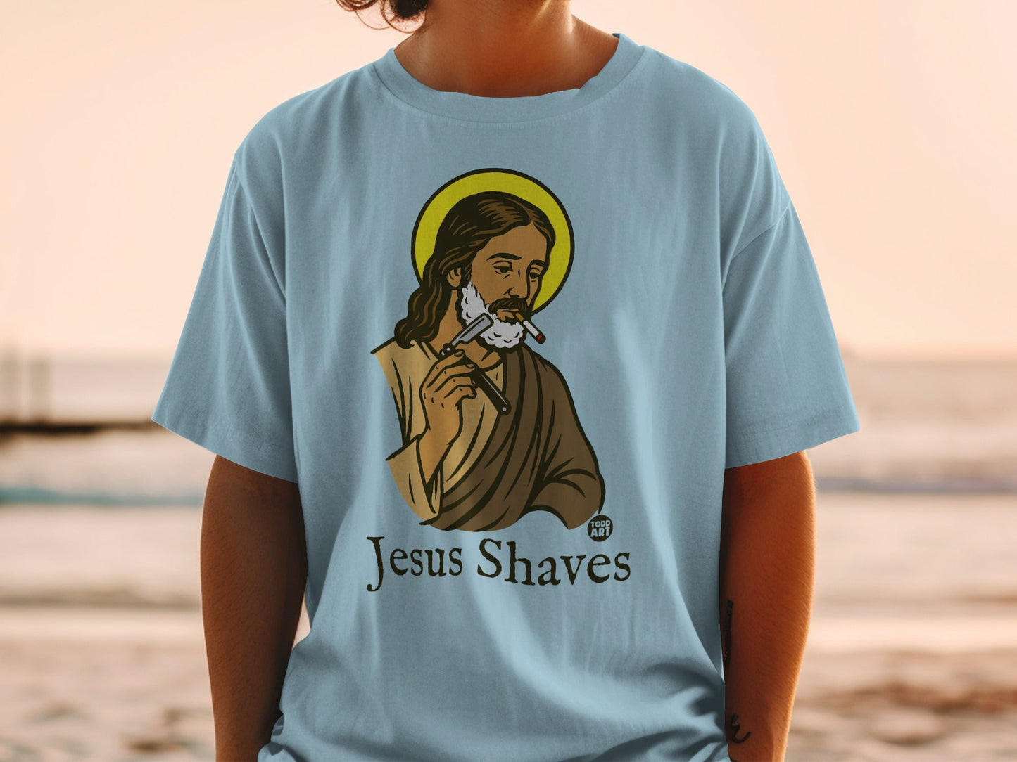 Jesus Shaves t-shirt design with Jesus shaving with a razor.