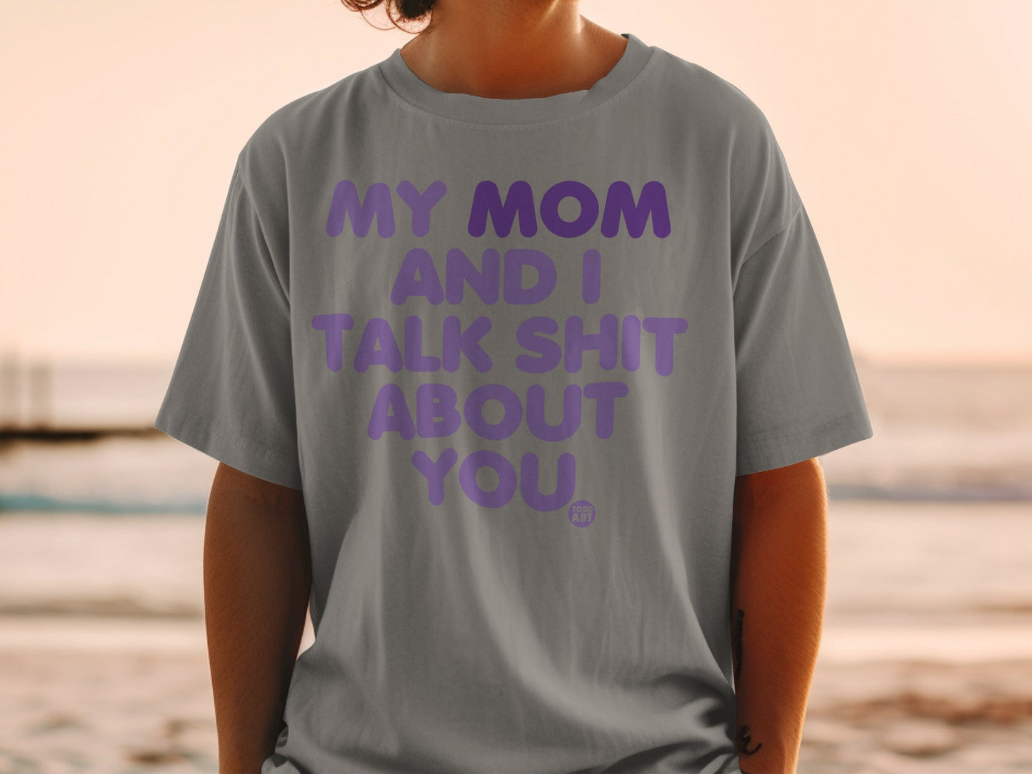 Gray t-shirt with purple text: MY MOM AND I TALK SHIT ABOUT YOU.