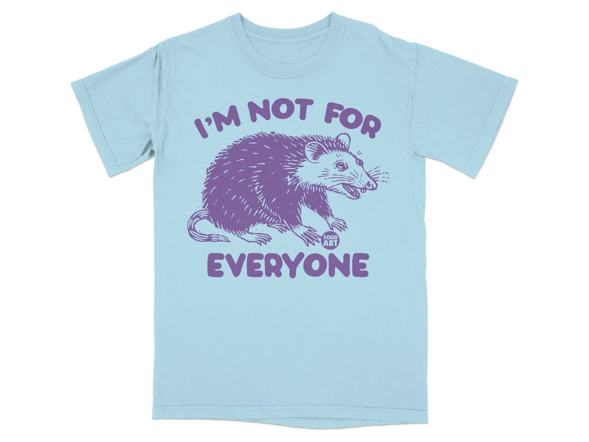 Light blue t-shirt with purple illustration of a possum and text "I'M NOT FOR EVERYONE".