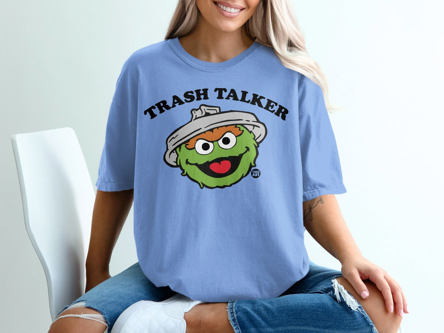 Blue t-shirt with green Oscar the Grouch character and "Trash Talker" text.