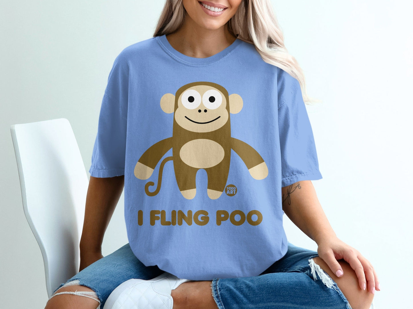 Blue t-shirt with a cartoon monkey graphic and text "I FLING POO".