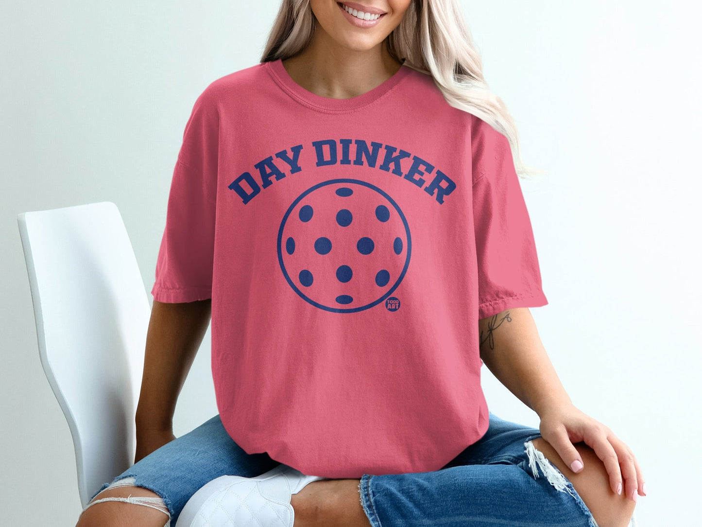 Pink t-shirt with "Day Dinker" and pickleball graphic.