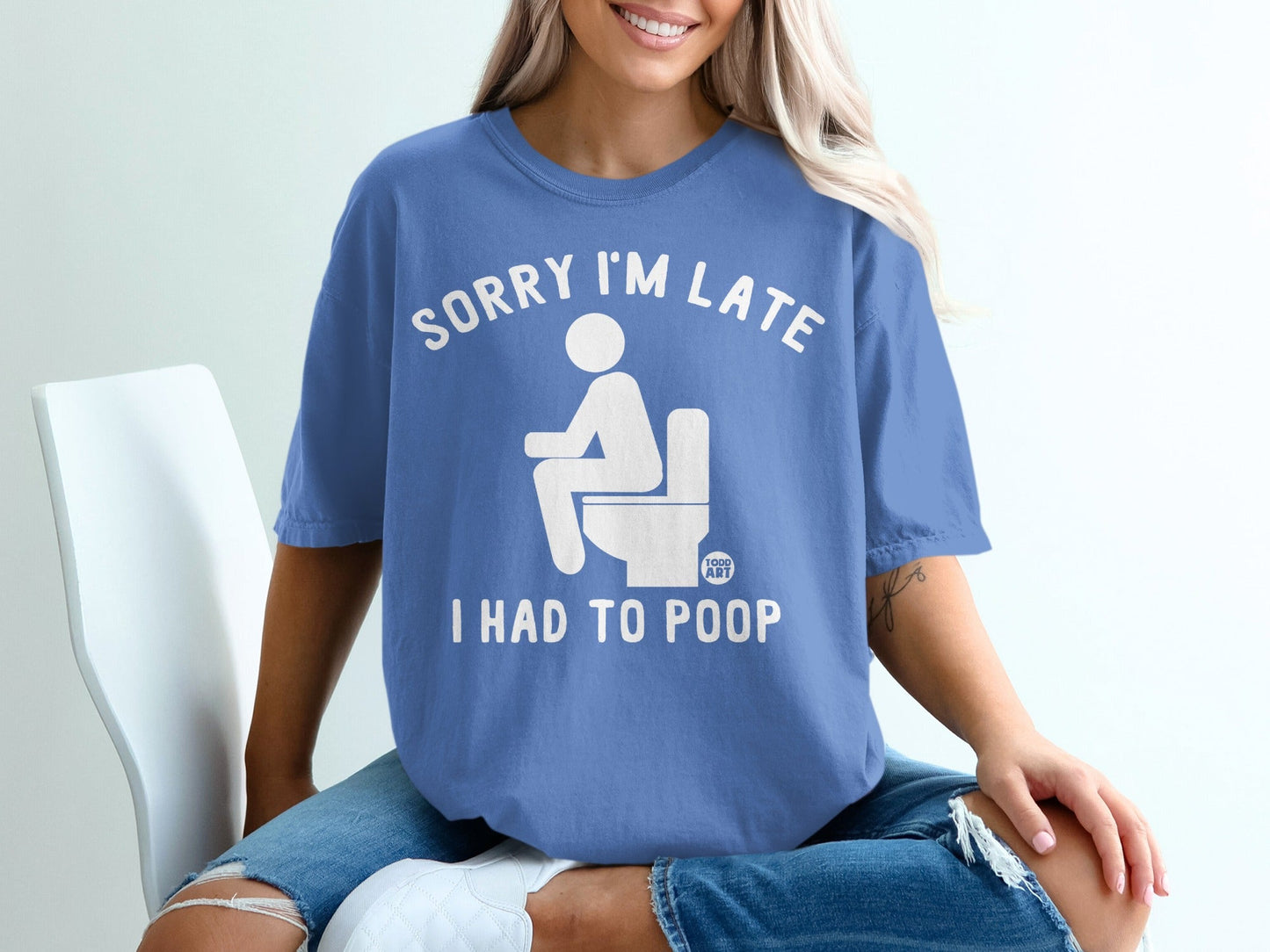 Blue t-shirt with white text and toilet graphic: "Sorry I'm late, I had to poop."