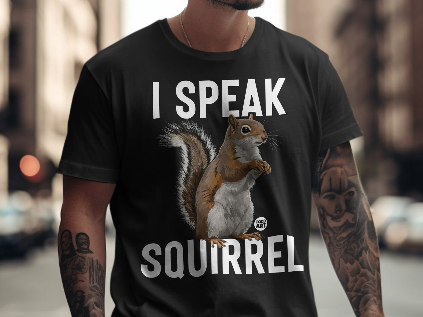 Black t-shirt with "I SPEAK SQUIRREL" and a squirrel graphic.
