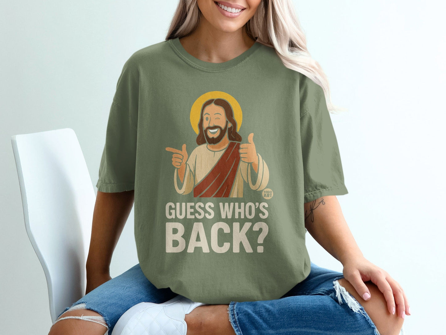 Jesus giving a thumbs up and pointing, wearing a t-shirt that says "Guess Who's Back?".