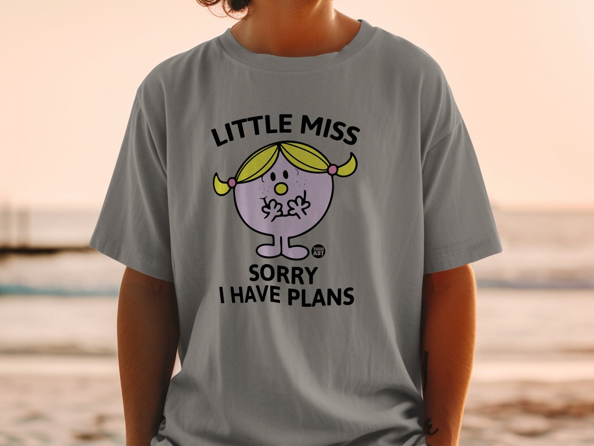 T-shirt with "Little Miss Sorry I Have Plans" graphic.