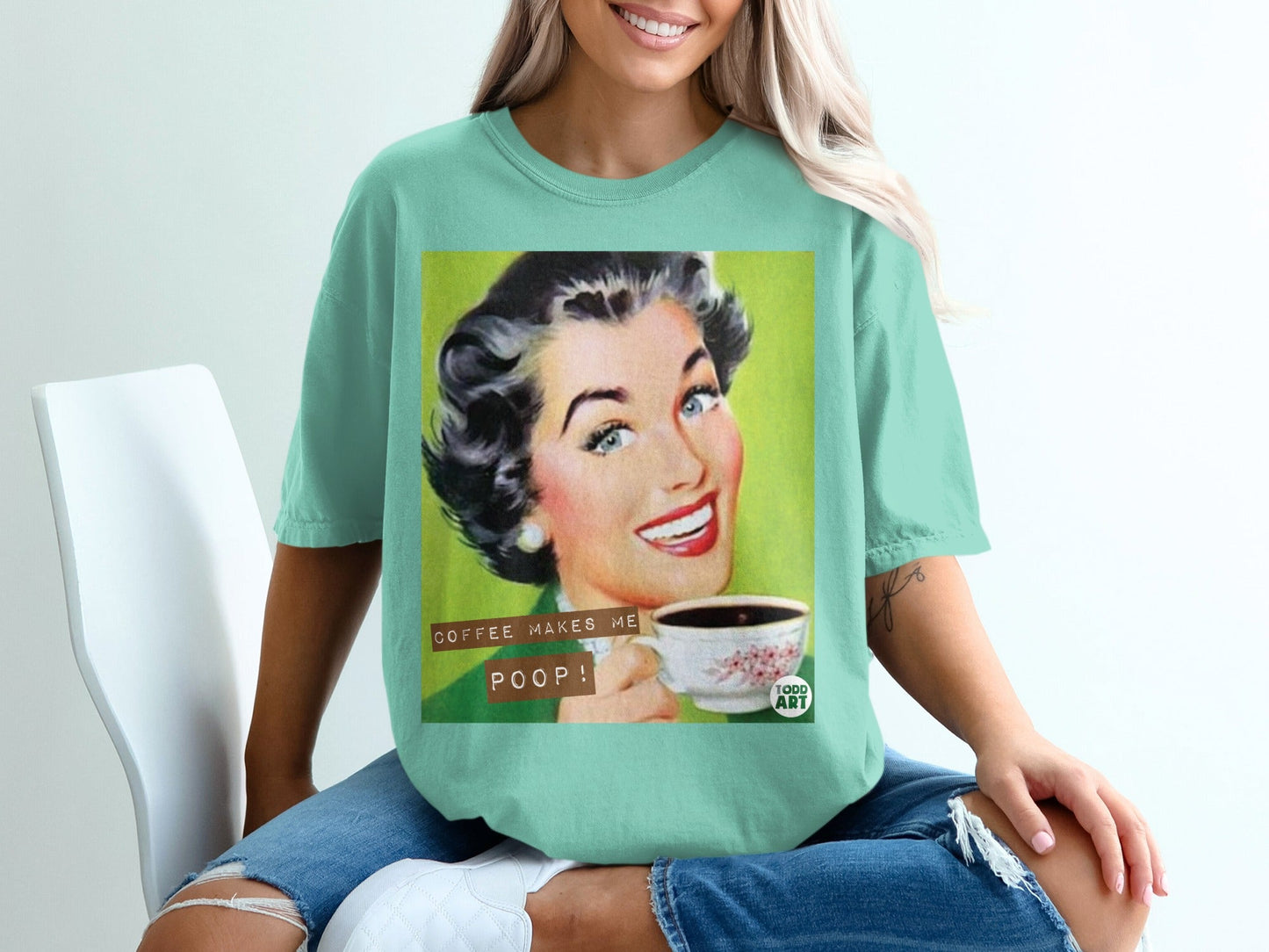 Woman in green shirt holding coffee cup with text "COFFEE MAKES ME POOP!".
