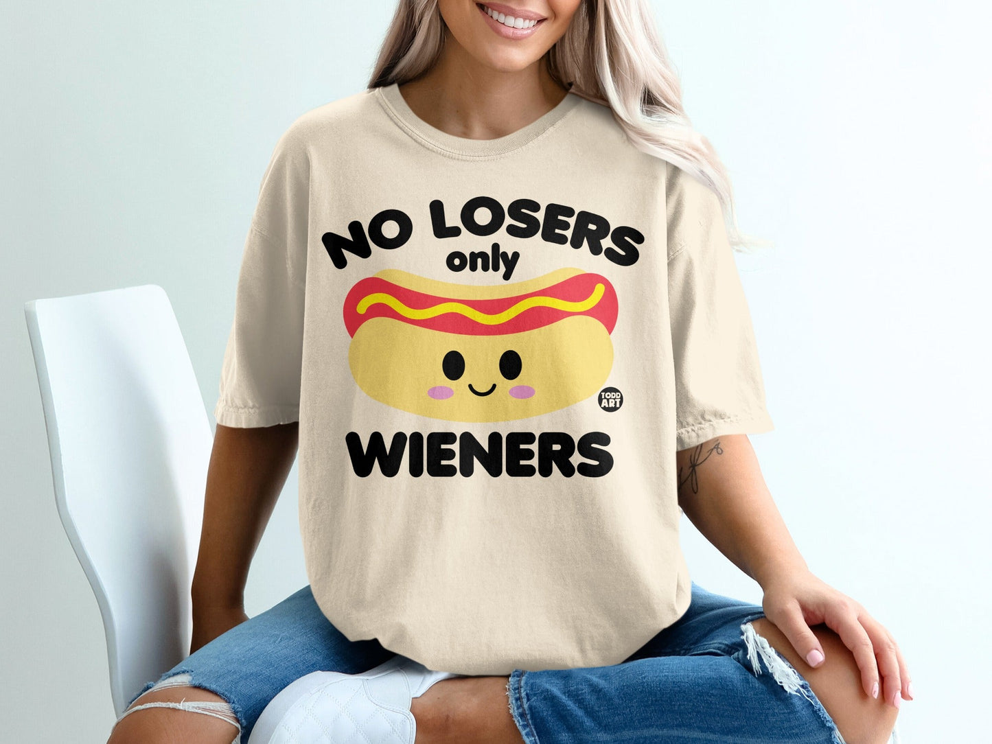 Cream t-shirt with "No Losers Only Wieners" and hot dog graphic.