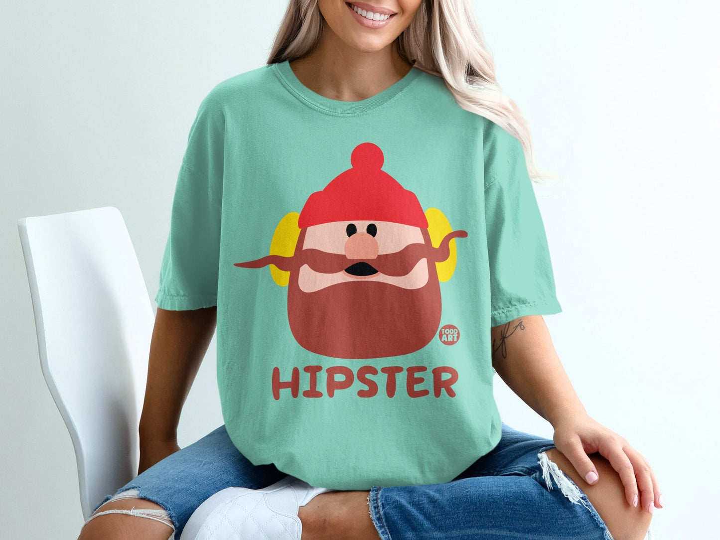 Teal t-shirt with cartoon hipster character and "TODD ART" logo.