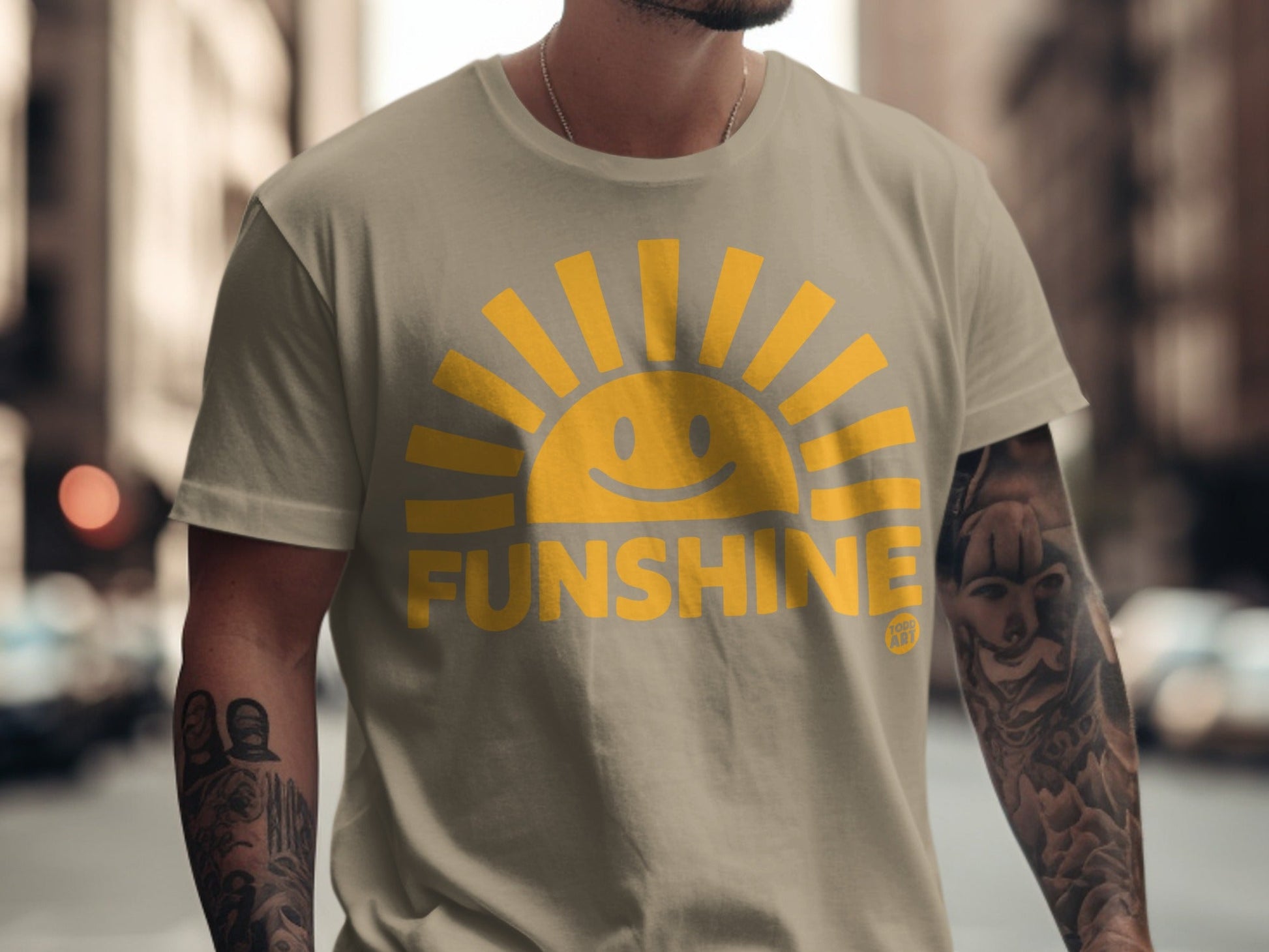 Tan t-shirt with a smiling sun graphic and the word "FUNSHINE" in yellow.
